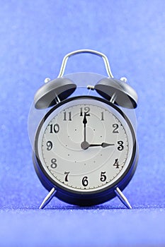 Alarms clock isolated with blue background