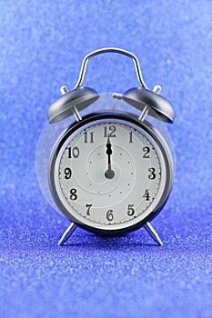 Alarms clock isolated with blue background