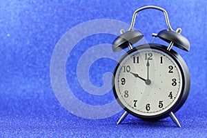 Alarms clock isolated with blue background