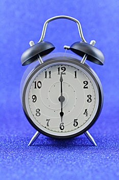 Alarms clock isolated with blue background