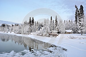 Alaska House on the River in Winter