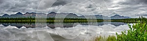 Alaska pine tree forest reflection on a lake 32:9 ultrawide photo