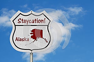 Alaska Staycation Highway Sign with sky