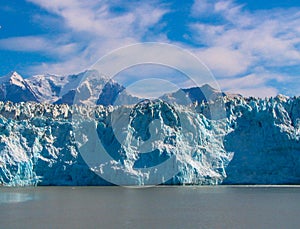 Alaskan Glacier in Blue Waters with Mountains