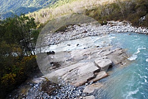 Alaskan Landscape with a Rockbed In The Creek