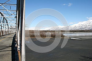 Alaskan mountains and old bridge