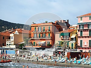 ALASSIO SAVONA, ITALY - SEPTEMBER 2019: Beautiful view on a sunny day of the sea and the town of Alassio with colorful buildings