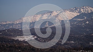 Alatau mountains view from Almaty with fogy haze