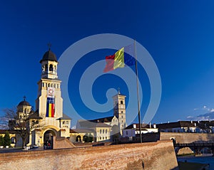 Alba Iulia Fortress and national flag photo