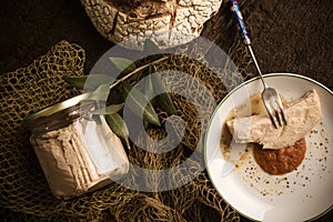 Albacore canned in glass bottle with olive oil photo