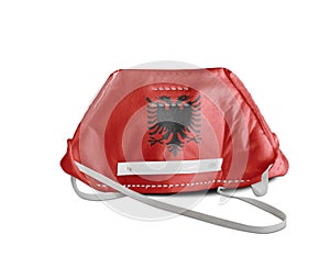 Albania flag on anti pollution mask medical protection