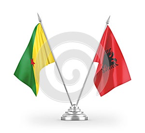 Albania and French Guiana table flags isolated on white 3D rendering