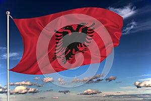 Albania national flag waving in the wind against deep blue sky.  International relations concept
