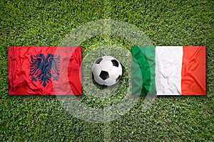 Albania vs. Italy flags on soccer field