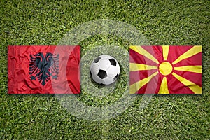 Albania vs. Macedonia flags on soccer field