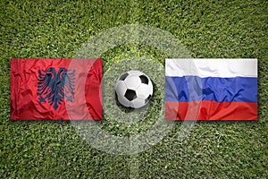 Albania vs. Russia flags on soccer field