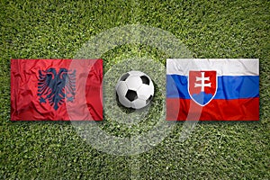 Albania vs. Slovakia flags on soccer field