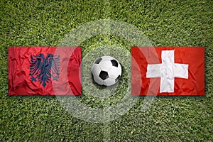 Albania vs. Switzerland flags on soccer field