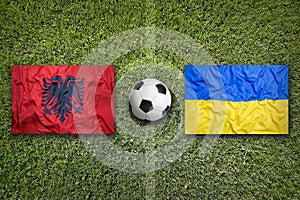 Albania vs. Ukraine flags on soccer field