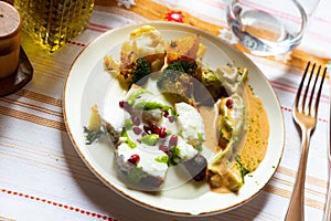 Albanian cornbread with yogurt sauce and baked vegetables