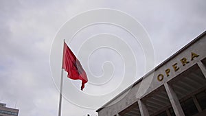 The Albanian flag waving in Tirana downtown