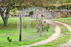 Albergue signboard in the garden, hostel, sign for pilgrims on Way of St James, Camino de Santiago, Spain photo