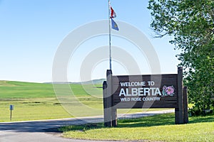 Welcome to Alberta Wild Rose Country sign just after crossing the United States Canadain border