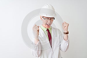 Albino scientist man wearing glasses and helmet standing over isolated white background celebrating mad and crazy for success with