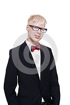 Albino young man portrait in eyeglasses and suit isolated.