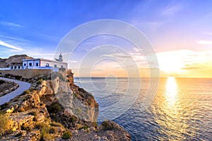 Albir lighthouse beautifully located on top of a cliff photo
