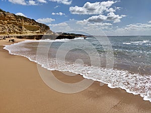 Albufeira beach water& x27;s edge, Algarve Portugal.