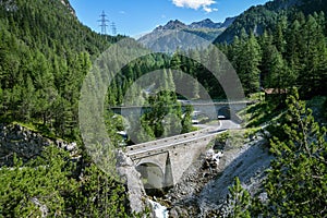 Albula high mountain pass road leading along famous Albula line railway between Bergun and Preda in Switzerland