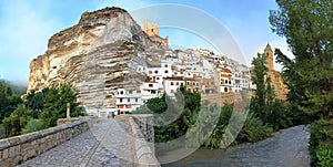 Alcala del Jucar, Castilia la Mancha, Spain, its castle towering above the white village photo