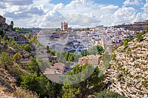 Alcala del Jucar, Castilia la Mancha, Spain, its castle towering above the white village photo