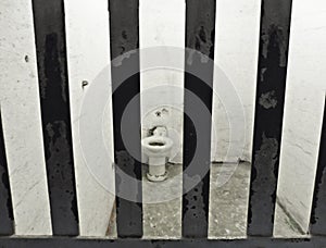 alcatraz cell with bars and hygienic sanitary