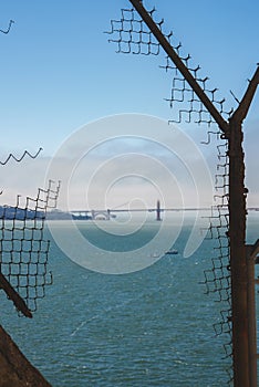 Alcatraz prison fence overlooking San Francisco Bay