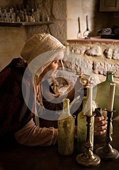 Alchemist in her medieval kitchen