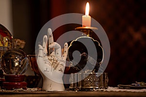Alchemy Palmistry hand model for fortune telling palm reading and other magical items in candlelight