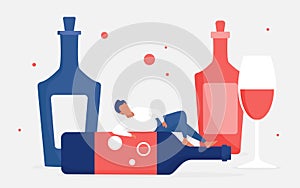 Alcohol addiction concept, adult man addict drinker character lying on empty big bottle