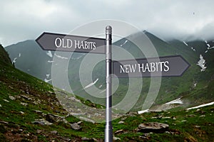 Alcohol addiction: what to choose - life with old bad habits or new good ones? Signpost with different directions against mountain