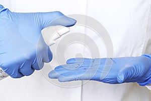 Alcohol antiseptic gel and latex gloves,prevent against infection of Covid-19 outbreak,woman washing hands