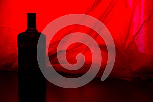 alcohol bottle on red backround