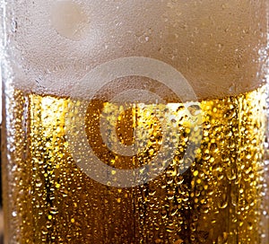 Alcohol drink beer on macro picture with sparkles and foam