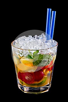 Alcohol drink, cocktail with fruits, ice, isolated black