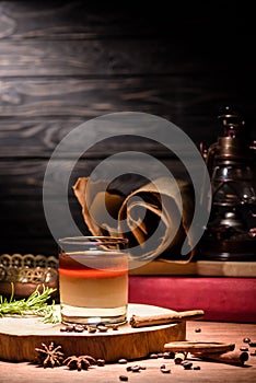 alcohol drink with coffee on wooden board, coffee beans
