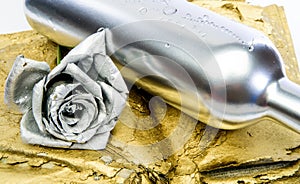Alcohol drink. Luxury wine. Metallic silver color. Winery concept. Floral wine. Metal flower in steel silver bottle