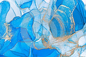 Alcohol ink blue transparent background. Blue, white and gold ink texture. Modern luxury paint natural colors with glitter. Templa