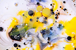 Alcohol ink mixing raster background. White fluid with black and yellow color bubbles illustration. Abstract