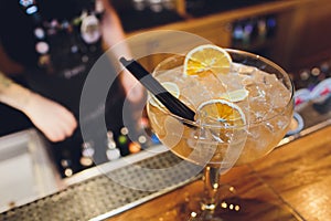 Alcohol in large round glass on bar background, Whisky, Brandy, Cognac.