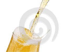 Alcohol light beer pouring into a glass isolated